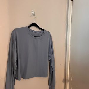 Long sleeve lulu lemon cropped shirts (one in black, one in baby blue).